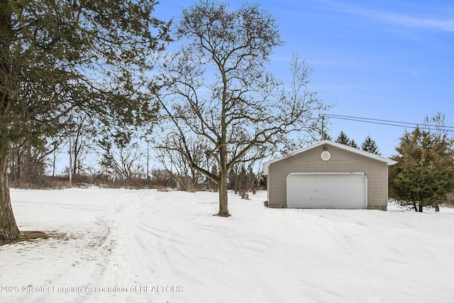 view of snow covered garage