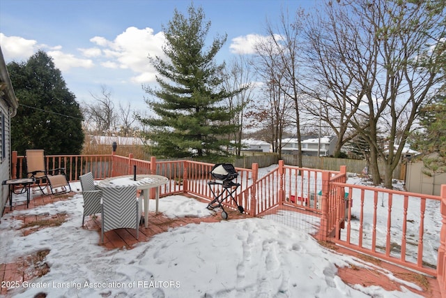 view of snow covered deck