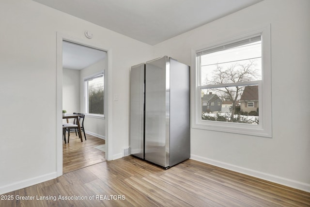 unfurnished bedroom with light wood-type flooring