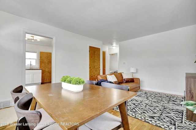 dining room with hardwood / wood-style floors