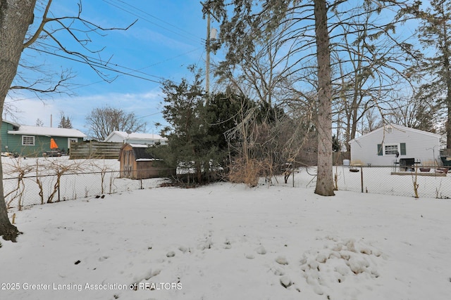 view of yard layered in snow