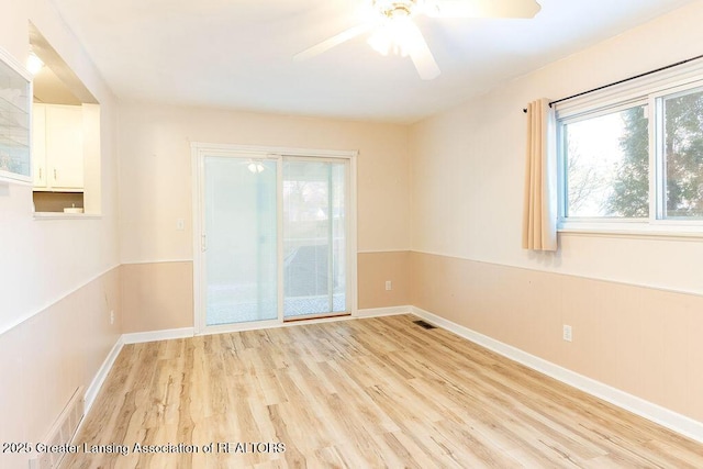 spare room with ceiling fan and light hardwood / wood-style flooring