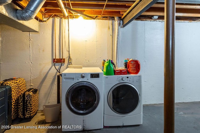 washroom with washing machine and dryer