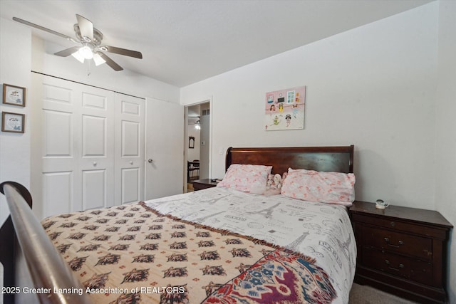 bedroom featuring ceiling fan and a closet