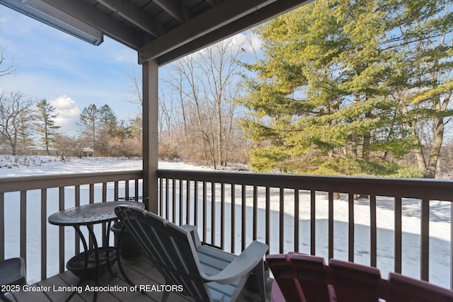 view of snow covered deck