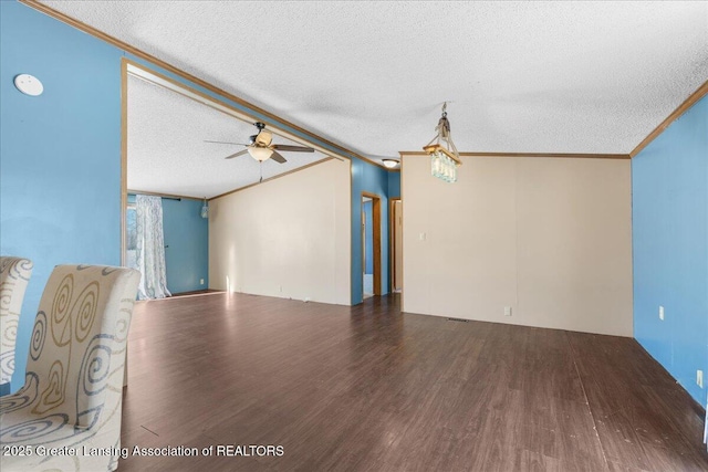 unfurnished living room with lofted ceiling, crown molding, a textured ceiling, dark hardwood / wood-style flooring, and ceiling fan