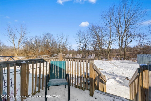 view of snow covered deck