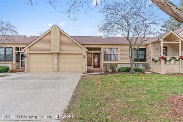 single story home with a garage and a front lawn