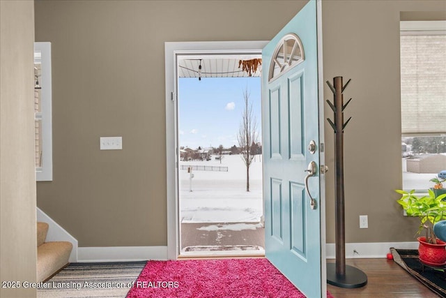 doorway with hardwood / wood-style flooring