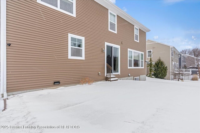 view of snow covered house