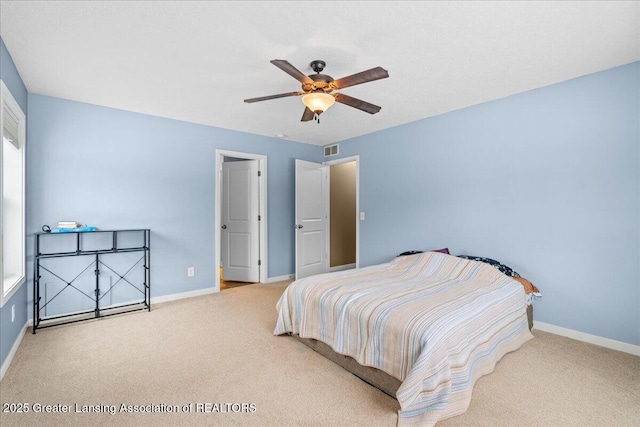 bedroom with ceiling fan and carpet