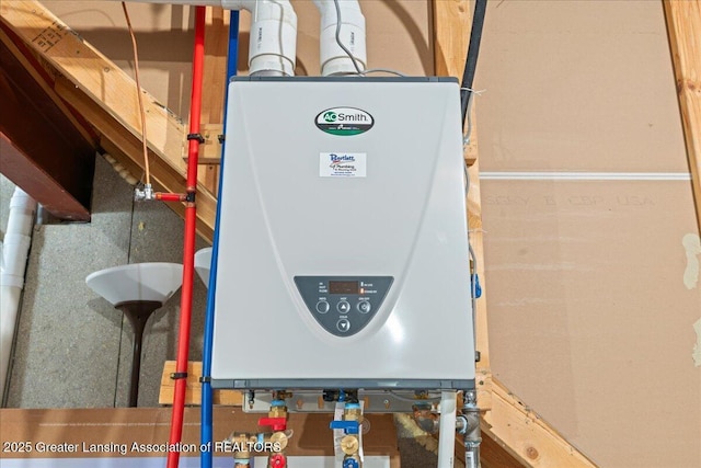 utility room featuring tankless water heater