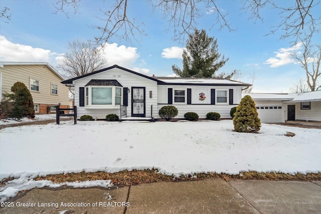 single story home featuring a garage