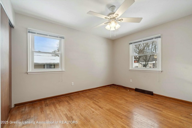 unfurnished room with ceiling fan and light hardwood / wood-style floors