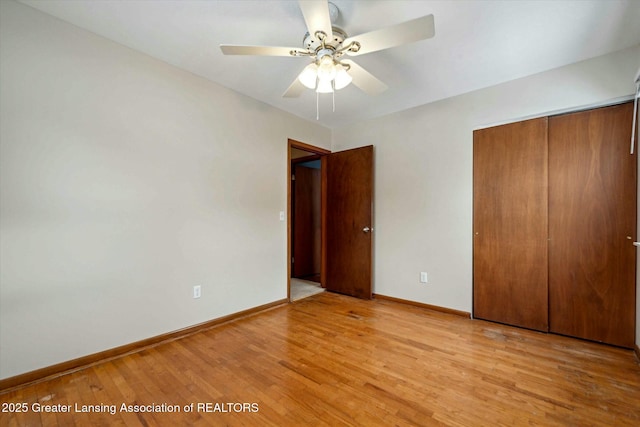 unfurnished bedroom with a closet, ceiling fan, and light wood-type flooring