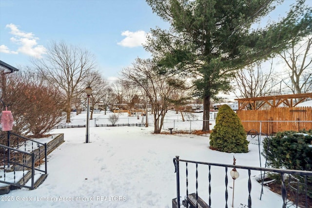 view of yard layered in snow