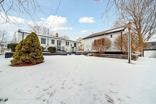 view of snow covered house