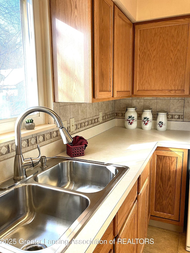 kitchen featuring sink and backsplash