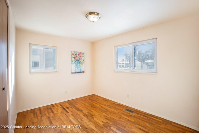 empty room with wood-type flooring