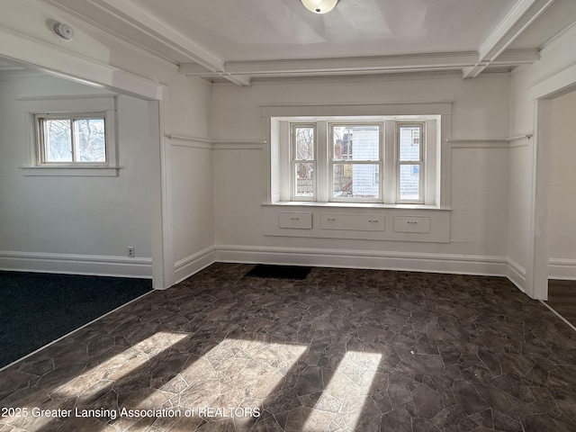 spacious closet featuring beamed ceiling and coffered ceiling