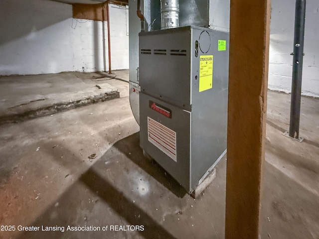 utility room featuring heating unit