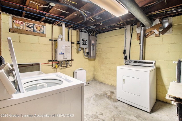 washroom featuring washing machine and clothes dryer and electric panel