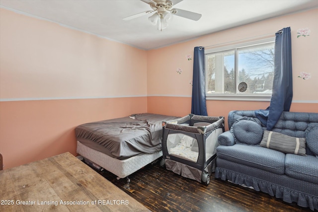 bedroom featuring dark hardwood / wood-style flooring and ceiling fan