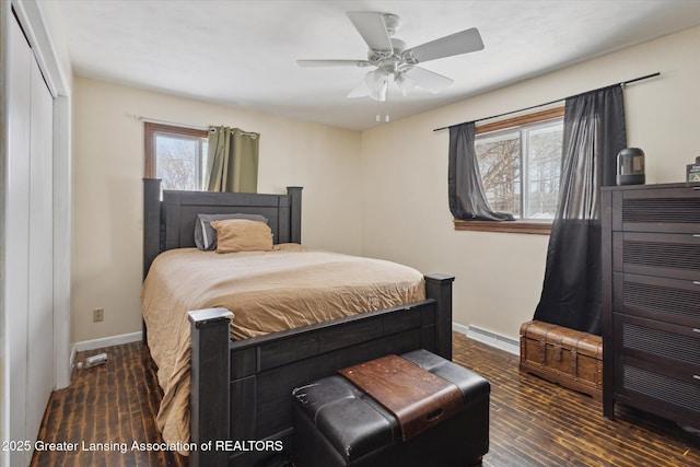 bedroom featuring a baseboard radiator, dark hardwood / wood-style floors, and ceiling fan