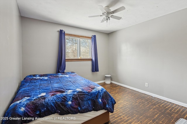 bedroom with ceiling fan and hardwood / wood-style floors