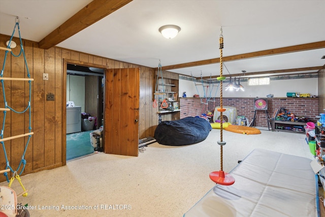 interior space with wooden walls and washer / dryer