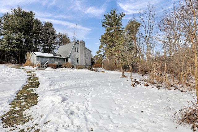 view of yard covered in snow