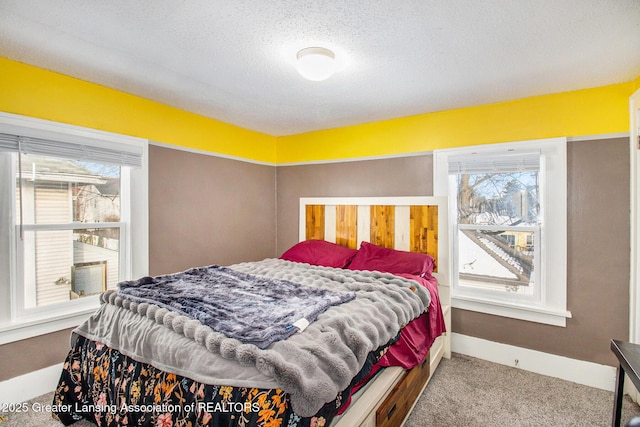 bedroom with carpet flooring and a textured ceiling