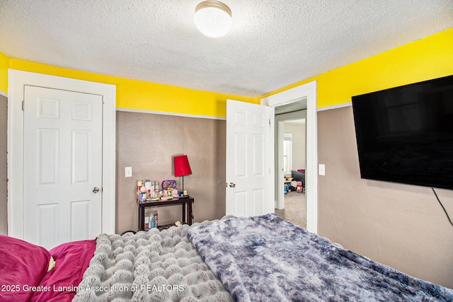 bedroom featuring a textured ceiling