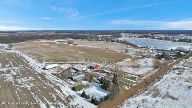 snowy aerial view with a rural view