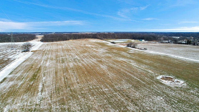 snowy aerial view with a rural view