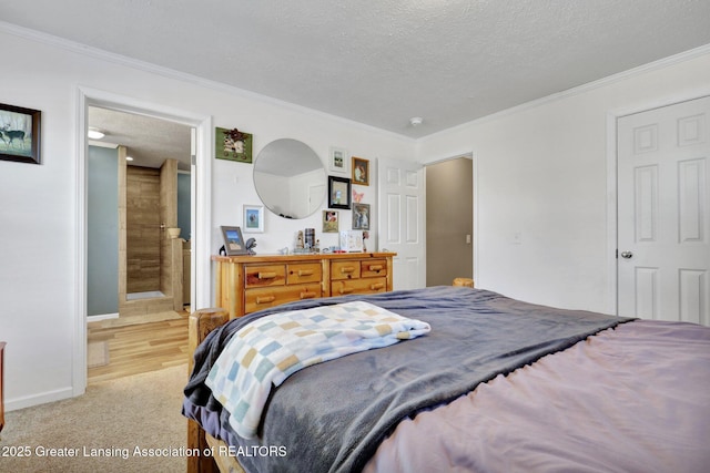 bedroom featuring ornamental molding, ensuite bathroom, light carpet, and a textured ceiling