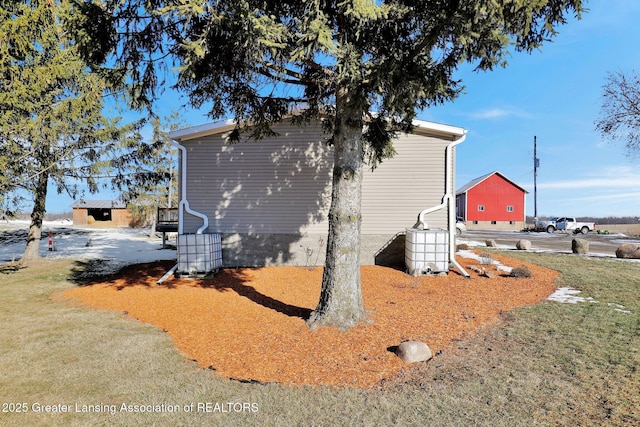 view of property exterior with a yard