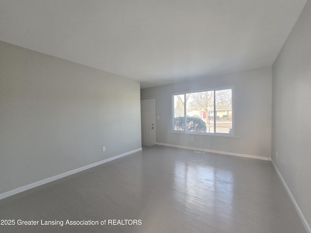 empty room featuring hardwood / wood-style flooring