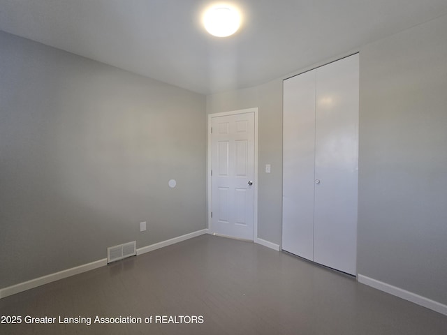 unfurnished bedroom featuring a closet