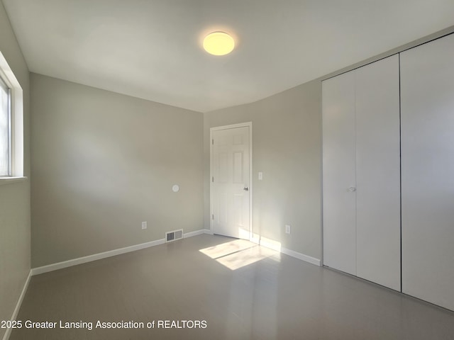 unfurnished bedroom featuring a closet