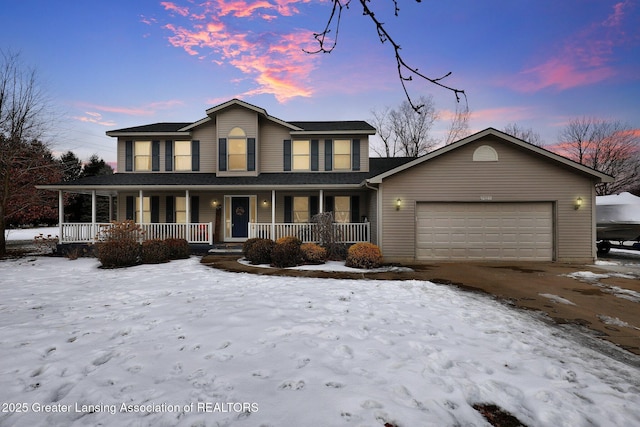 view of front of house featuring a garage and a porch