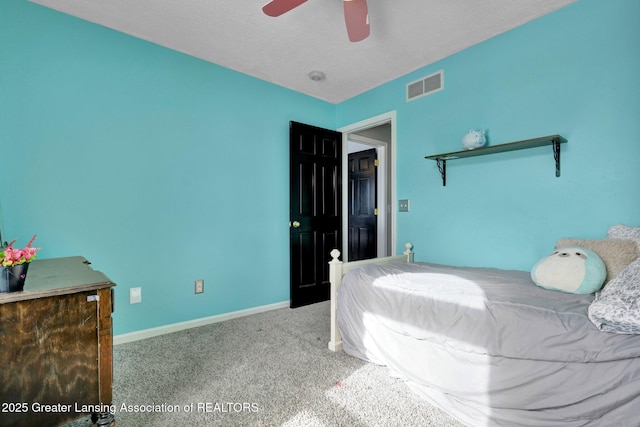 bedroom with ceiling fan and carpet floors