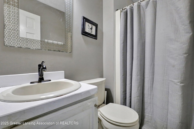 bathroom featuring vanity and toilet