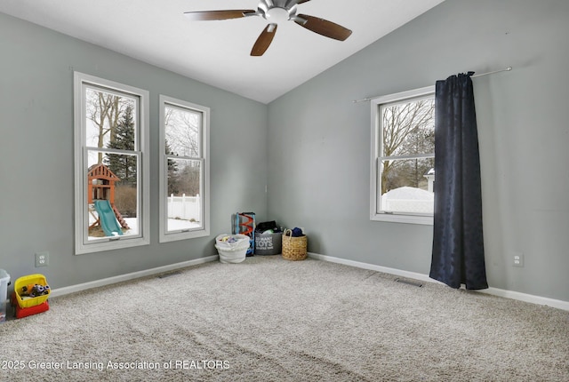 interior space featuring vaulted ceiling and ceiling fan