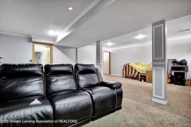 home theater room with ornamental molding, carpet, and ornate columns