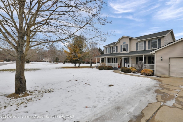 view of front facade featuring a garage and covered porch