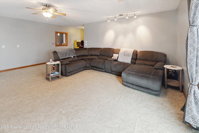 living room with ceiling fan and carpet flooring