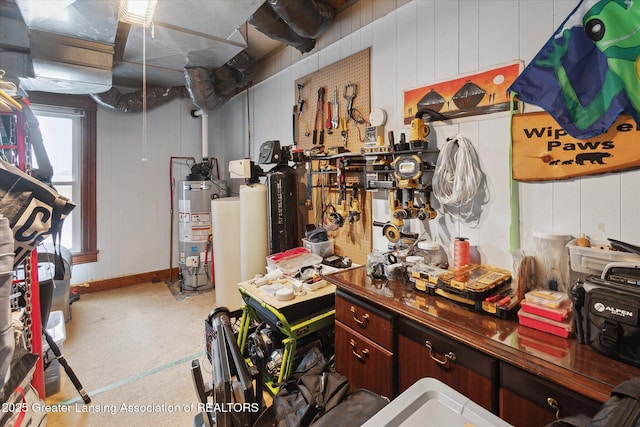 interior space featuring water heater and a workshop area