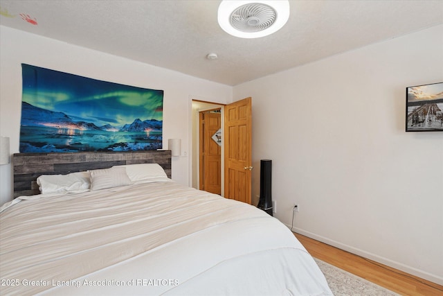 bedroom featuring wood-type flooring