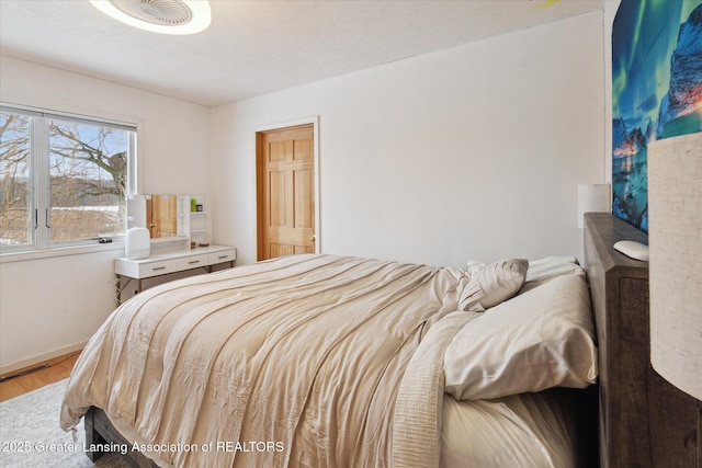 bedroom featuring hardwood / wood-style floors